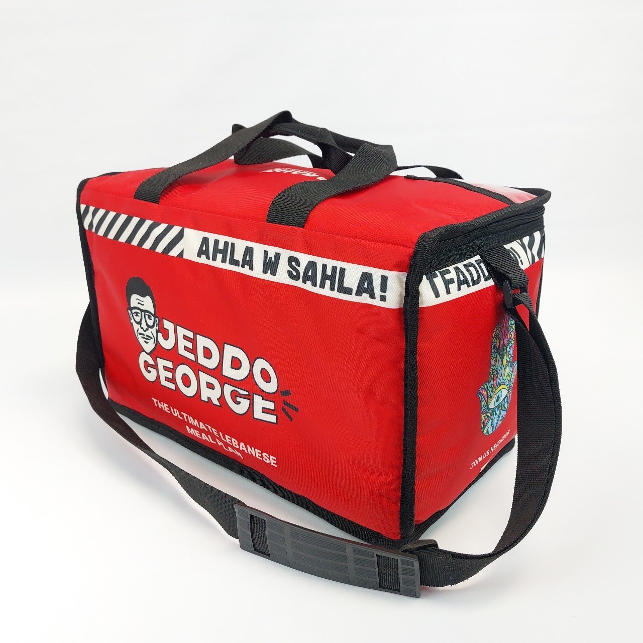 The Jeddo George insulated cooler bag, red with the jeddo face and Ahla w Sahla across the top